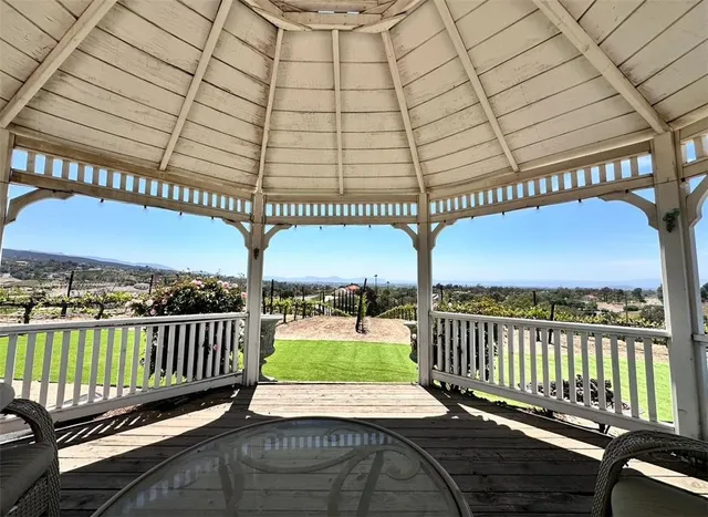 a view of a patio with wooden floor
