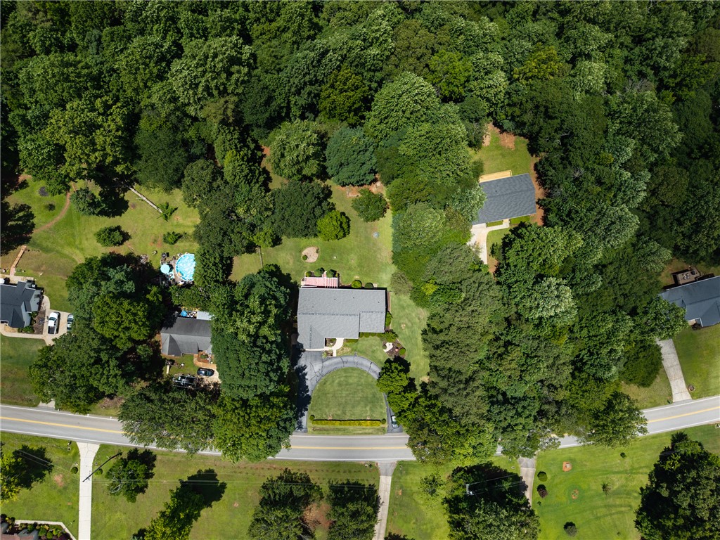 429 Burns Mill Road West Union, SC 29696 - Photo 41 of 49 An aerial perspective reveals a private pool oasis nestled among abundant mature trees, creating a serene environment.