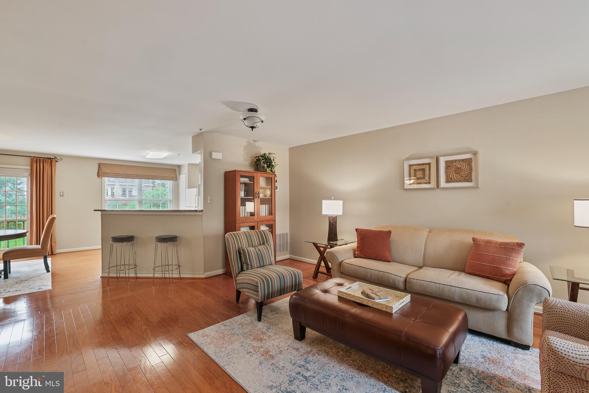 2128 Elm Tree Lane Silver Spring, MD 20906 - Photo 18 of 55 a living room with furniture and a wooden floor