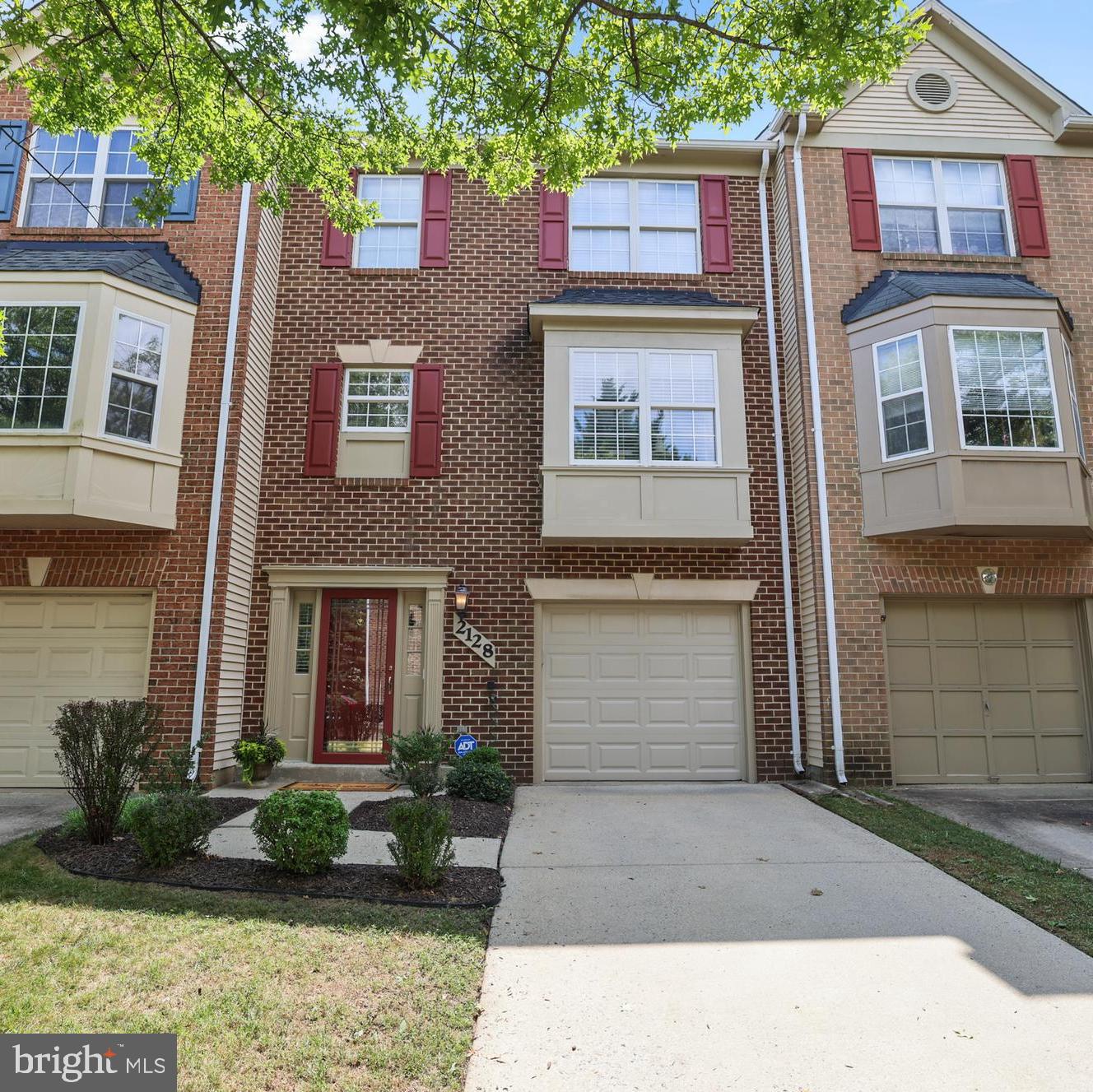 2128 Elm Tree Lane Silver Spring, MD 20906 - Photo 2 of 55 a front view of a house with garden