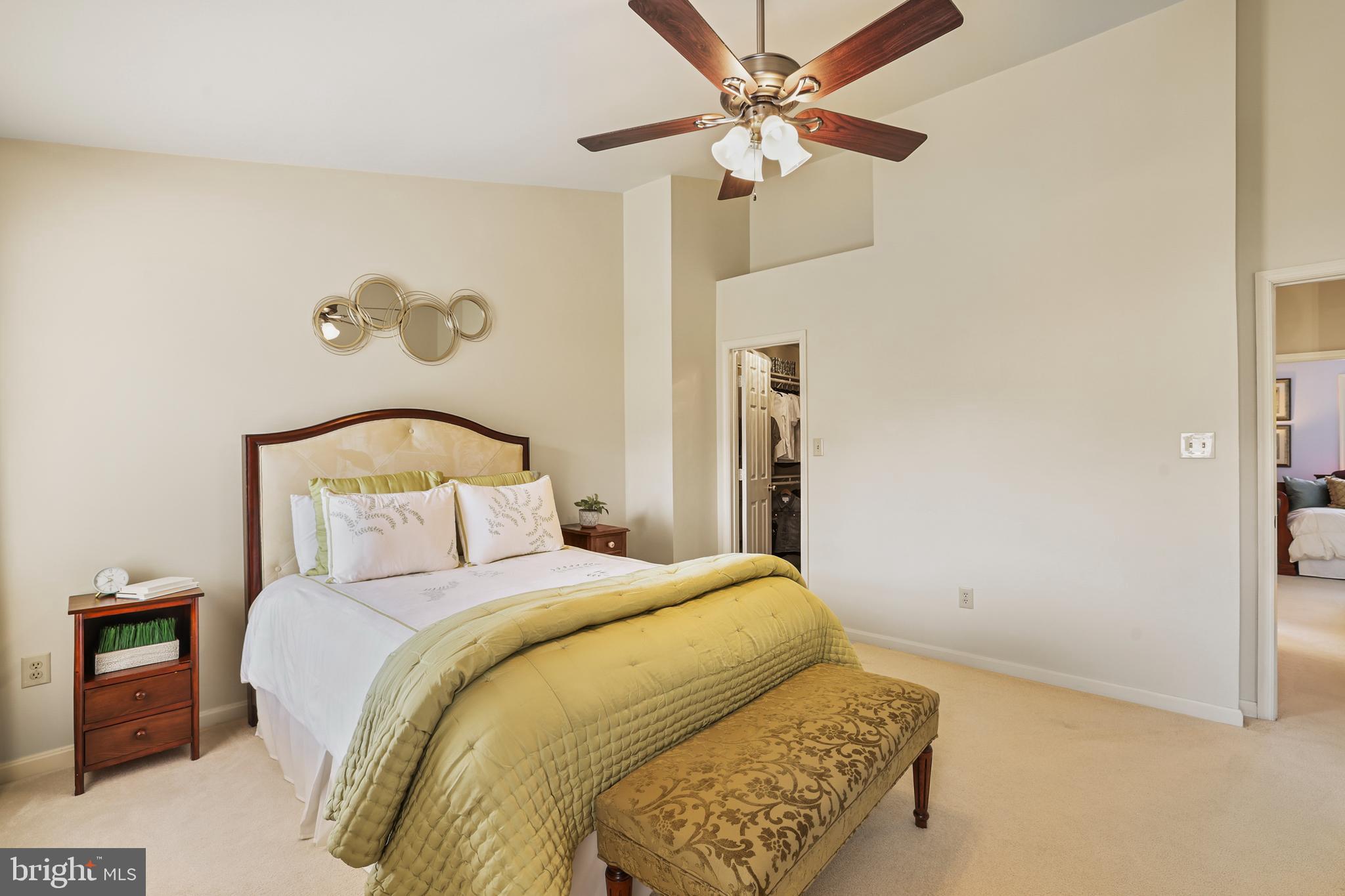 2128 Elm Tree Lane Silver Spring, MD 20906 - Photo 22 of 55 a bedroom with a bed and a chandelier