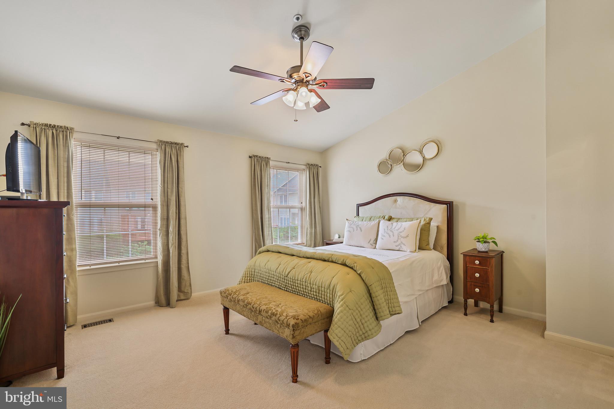 2128 Elm Tree Lane Silver Spring, MD 20906 - Photo 23 of 55 a spacious bedroom with a bed and a window