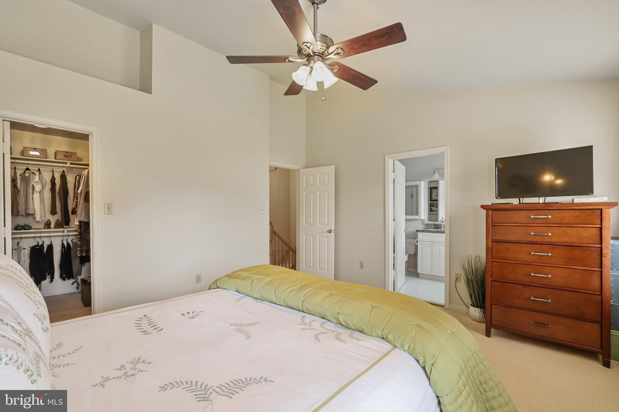 2128 Elm Tree Lane Silver Spring, MD 20906 - Photo 24 of 55 a bedroom with a bed and a flat screen tv