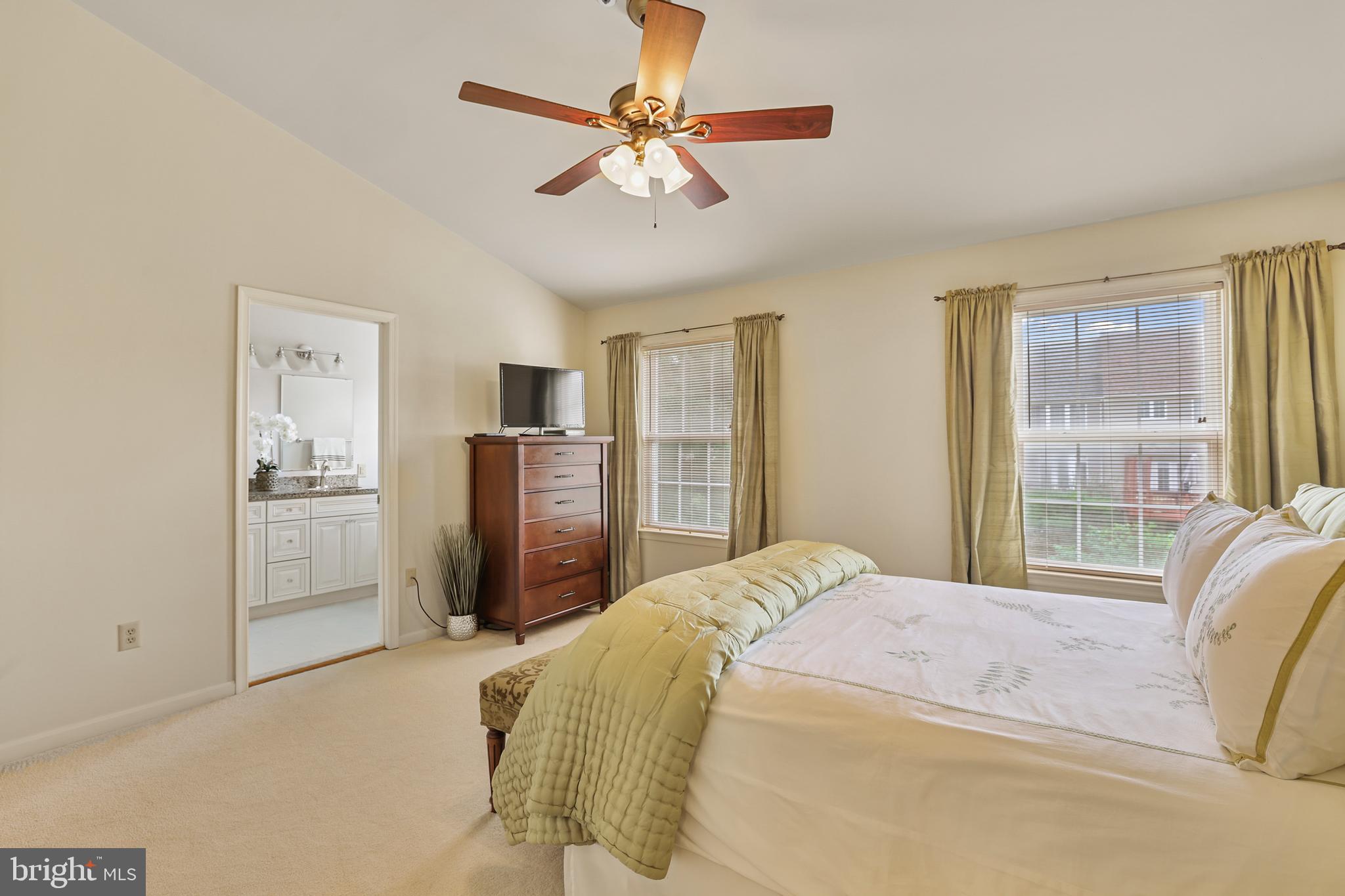 2128 Elm Tree Lane Silver Spring, MD 20906 - Photo 26 of 55 a bedroom with a bed and a refrigerator