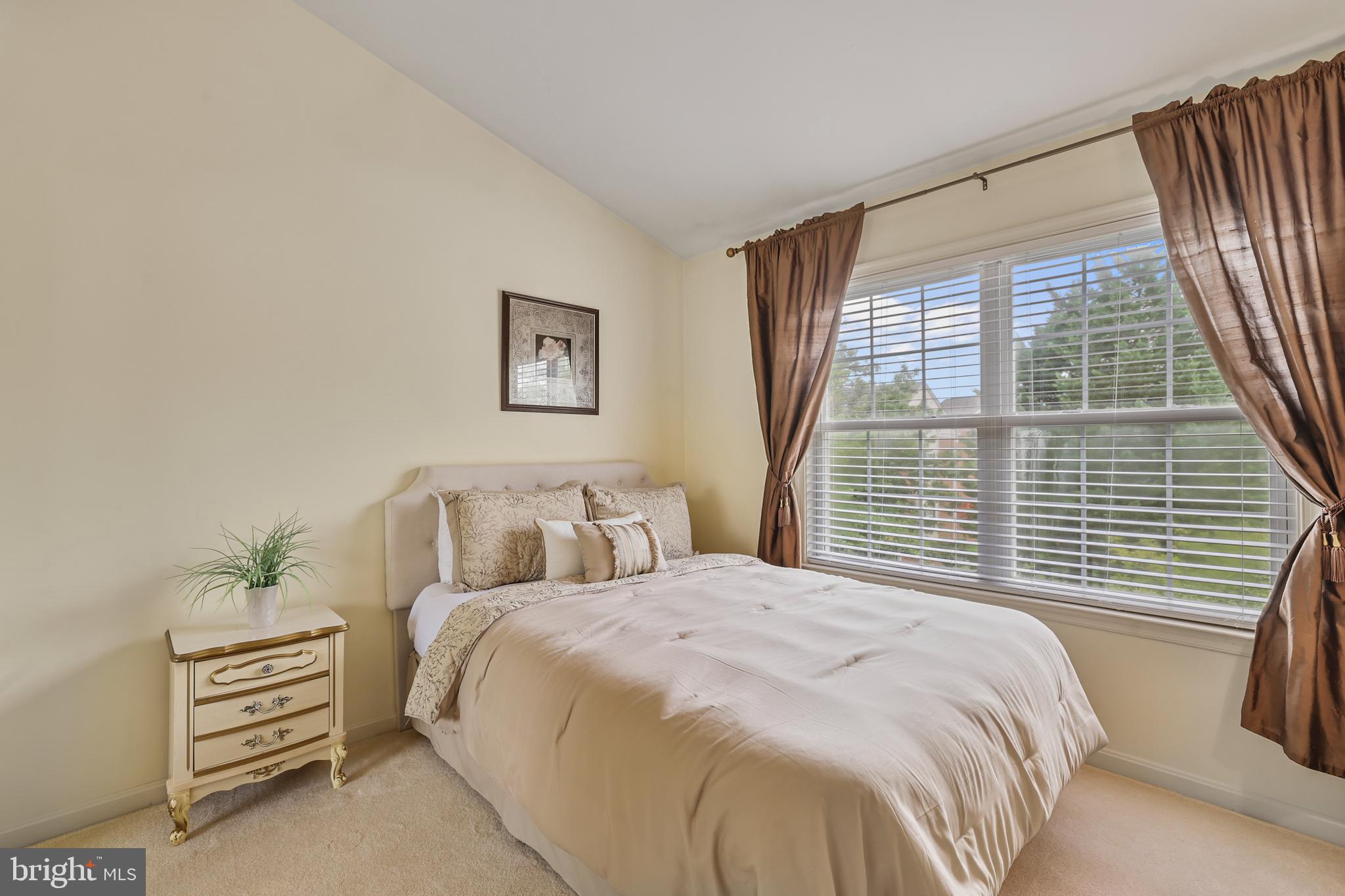 2128 Elm Tree Lane Silver Spring, MD 20906 - Photo 29 of 55 a bedroom with a bed and a window