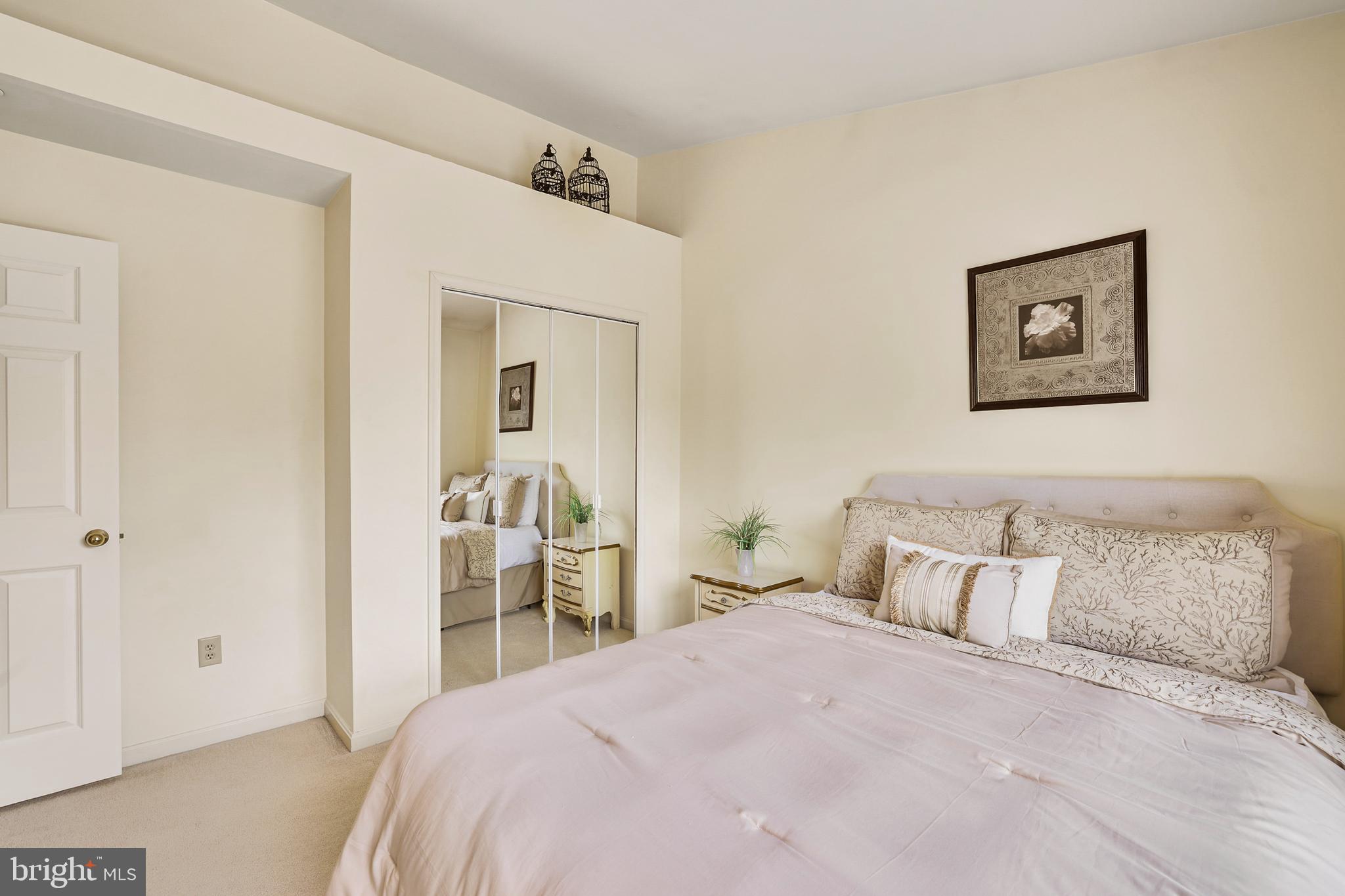 2128 Elm Tree Lane Silver Spring, MD 20906 - Photo 30 of 55 a bedroom with a bed and a painting on the wall