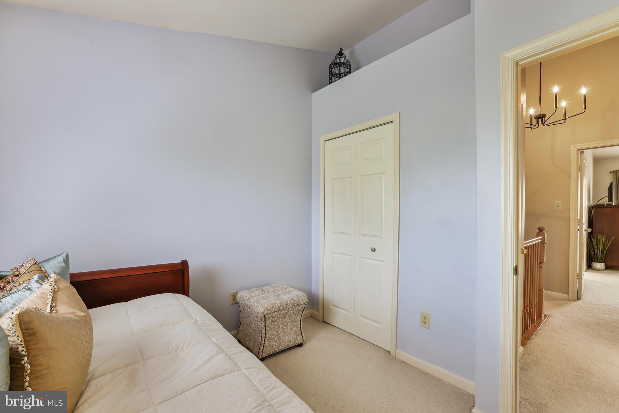 2128 Elm Tree Lane Silver Spring, MD 20906 - Photo 33 of 55 a bedroom with a bed and a mirror