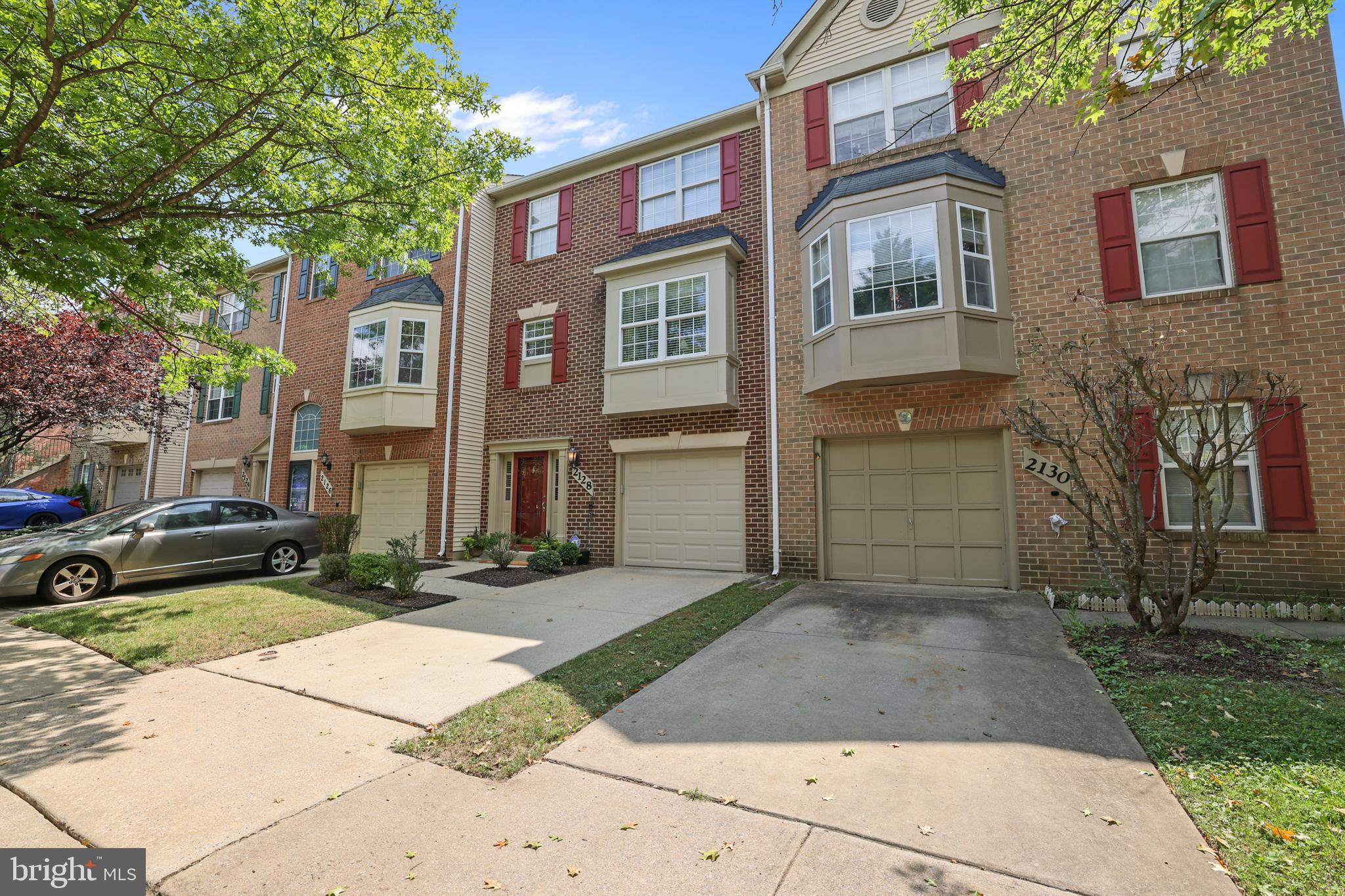 2128 Elm Tree Lane Silver Spring, MD 20906 - Photo 47 of 55 a front view of a house with a yard