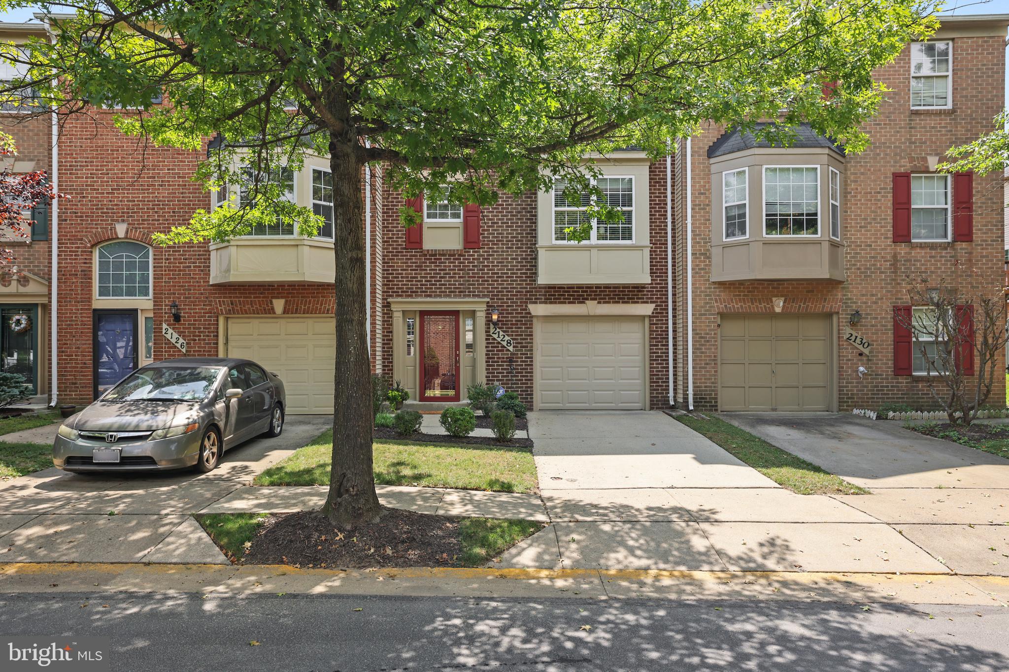 2128 Elm Tree Lane Silver Spring, MD 20906 - Photo 49 of 55 a front view of a house with a yard