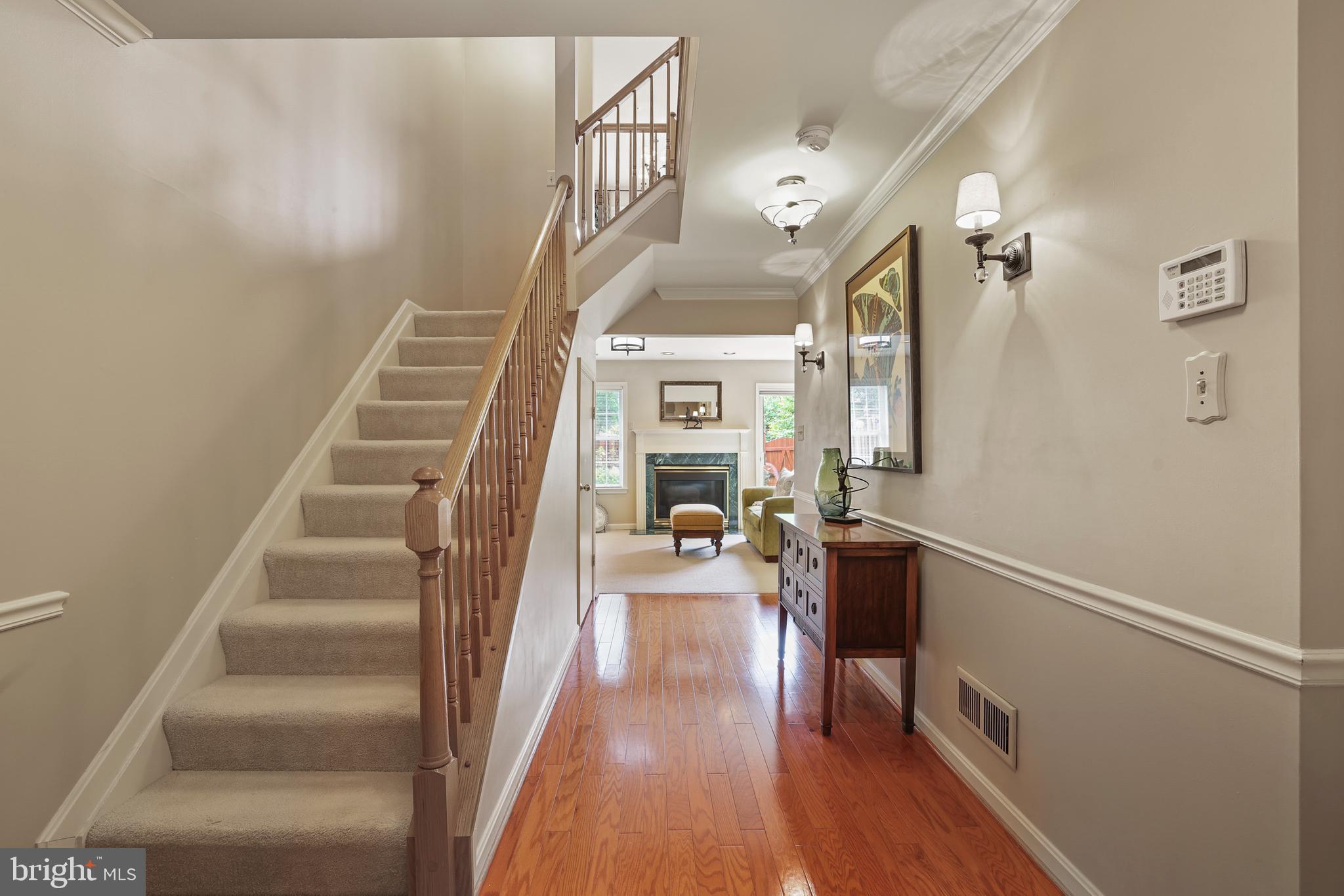 2128 Elm Tree Lane Silver Spring, MD 20906 - Photo 5 of 55 a view of a hallway with wooden floor and staircase