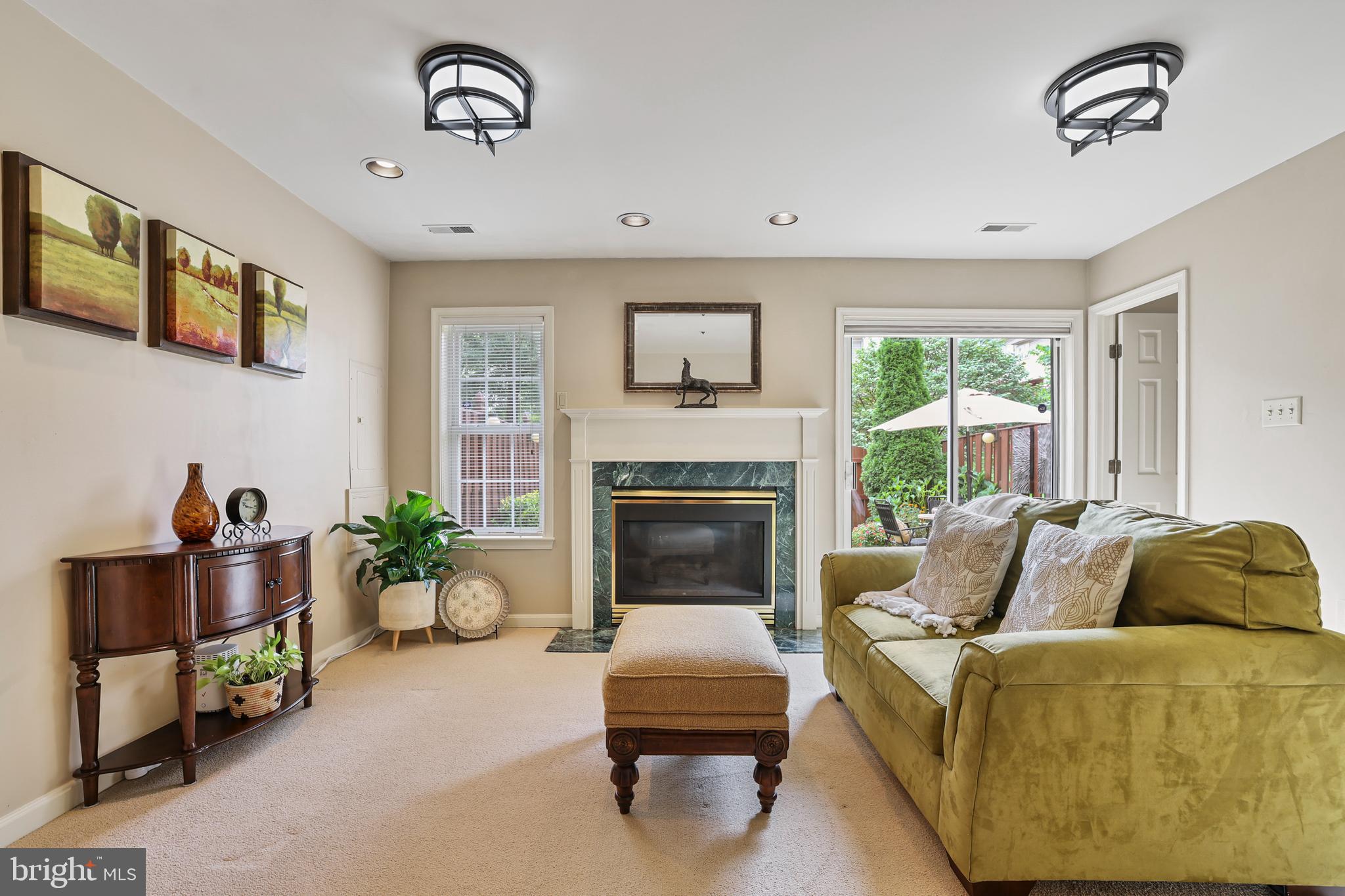 2128 Elm Tree Lane Silver Spring, MD 20906 - Photo 7 of 55 a living room with furniture and a fireplace