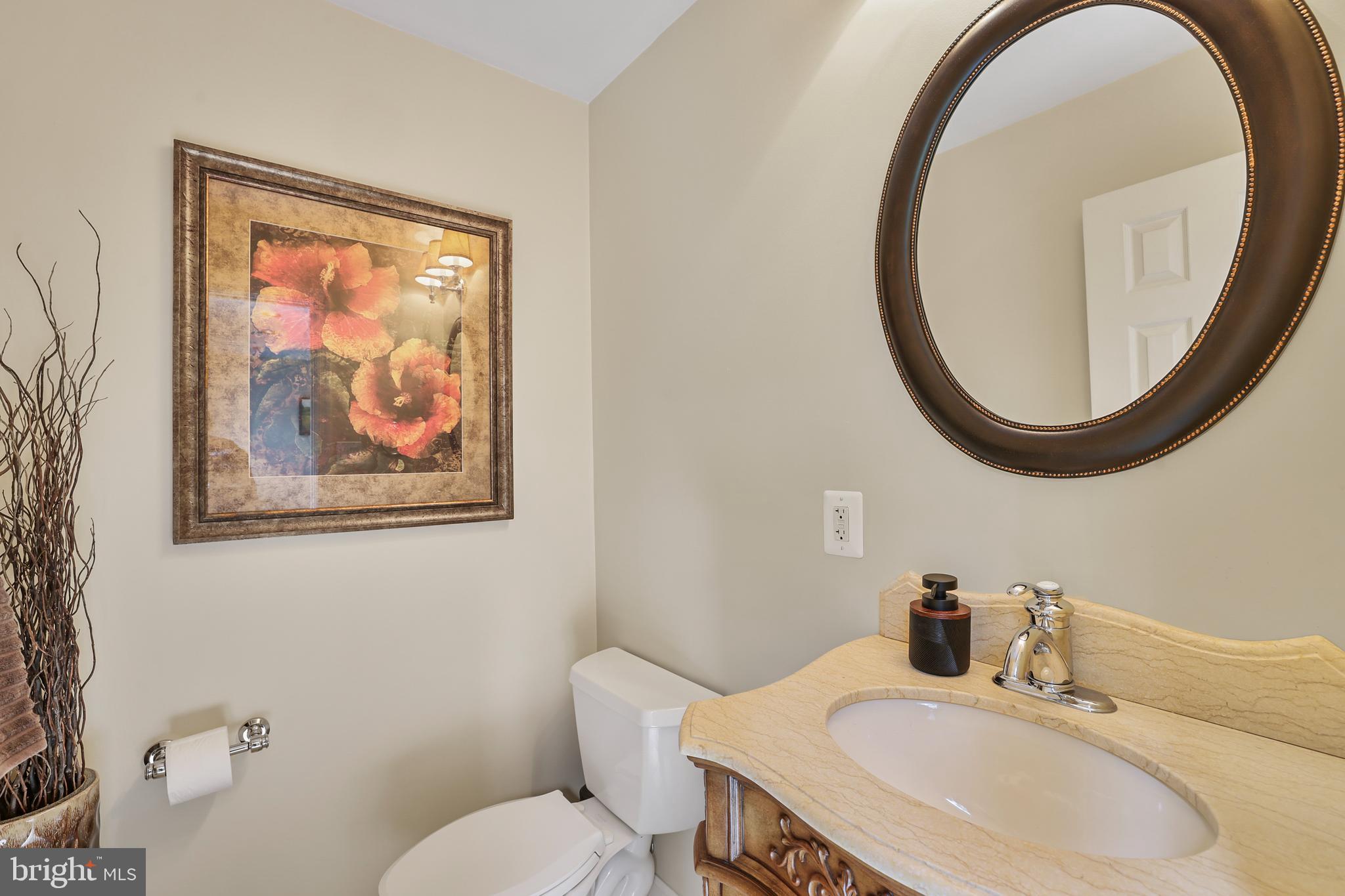 2128 Elm Tree Lane Silver Spring, MD 20906 - Photo 10 of 55 a bathroom with a toilet and a sink