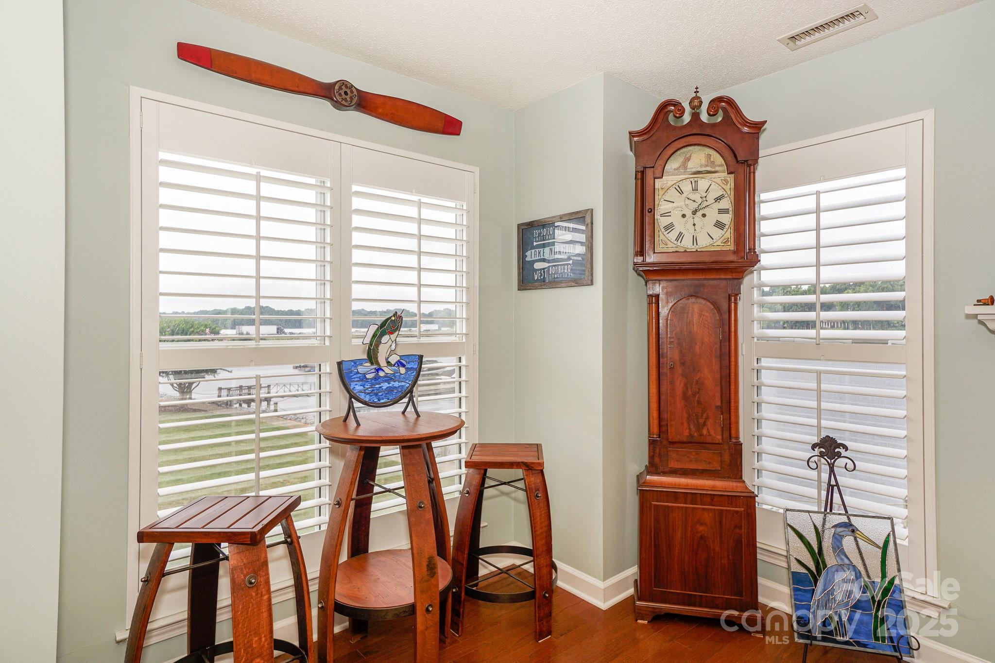 1238 Torrence Circle Davidson, NC 28036 - Photo 13 of 43 a view of a room that has a bench and a table in it