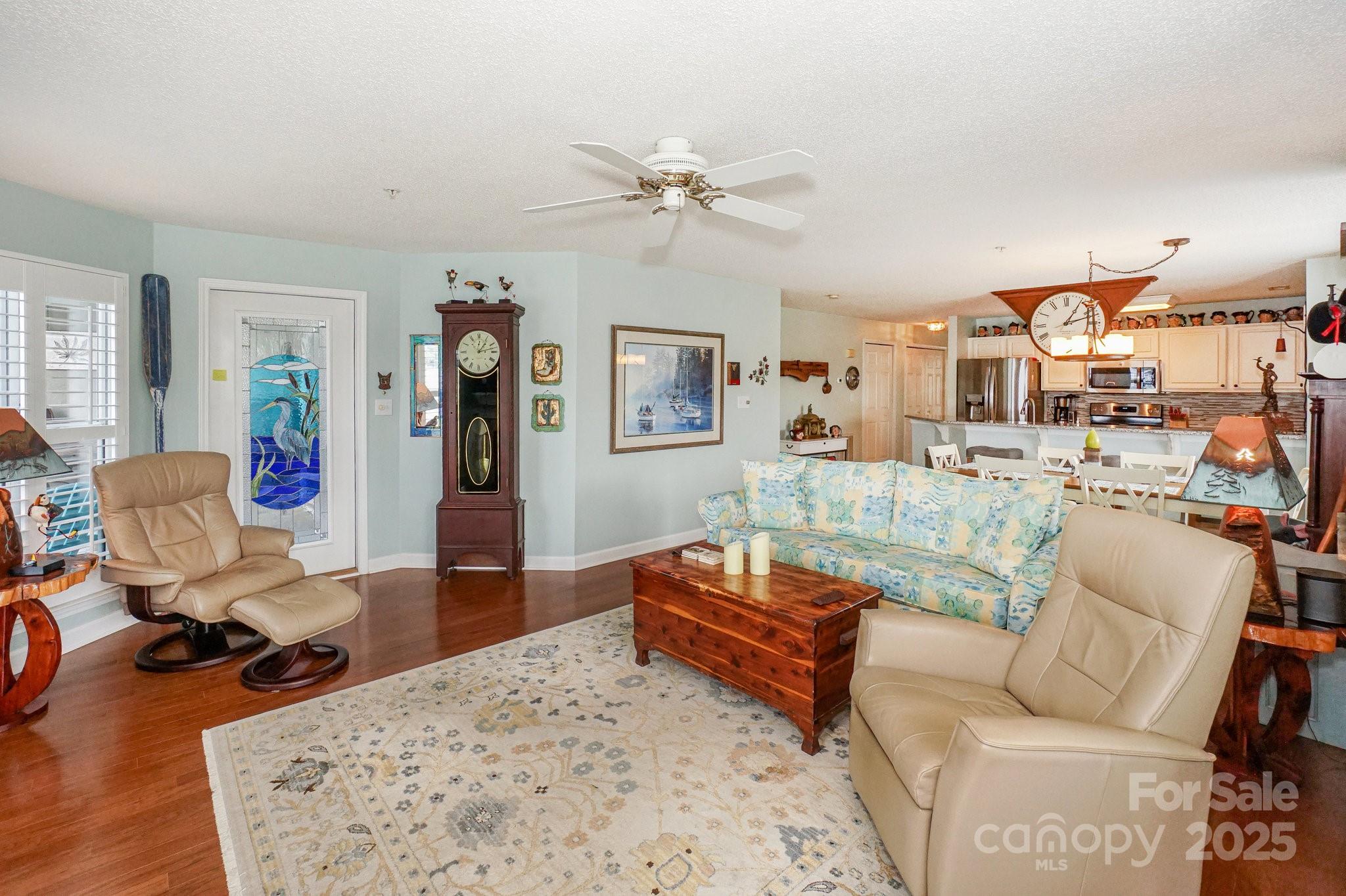 1238 Torrence Circle Davidson, NC 28036 - Photo 15 of 43 a living room with furniture and a wooden floor