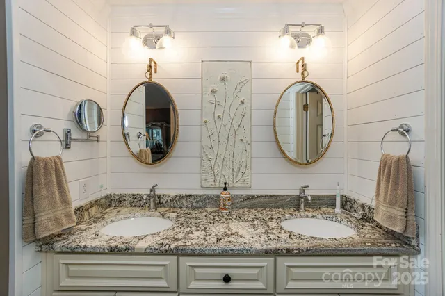 a bathroom with sinks and mirror