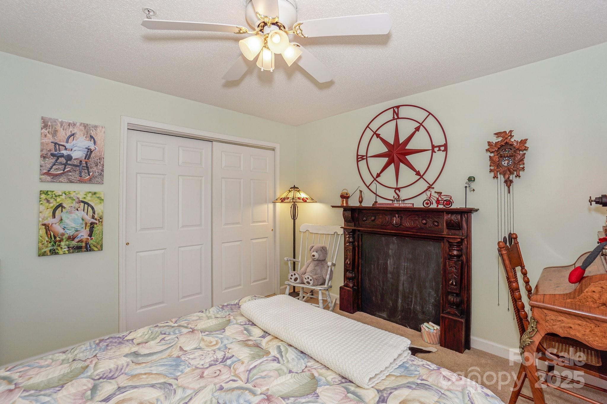 1238 Torrence Circle Davidson, NC 28036 - Photo 32 of 43 a bedroom with a bed and cabinets