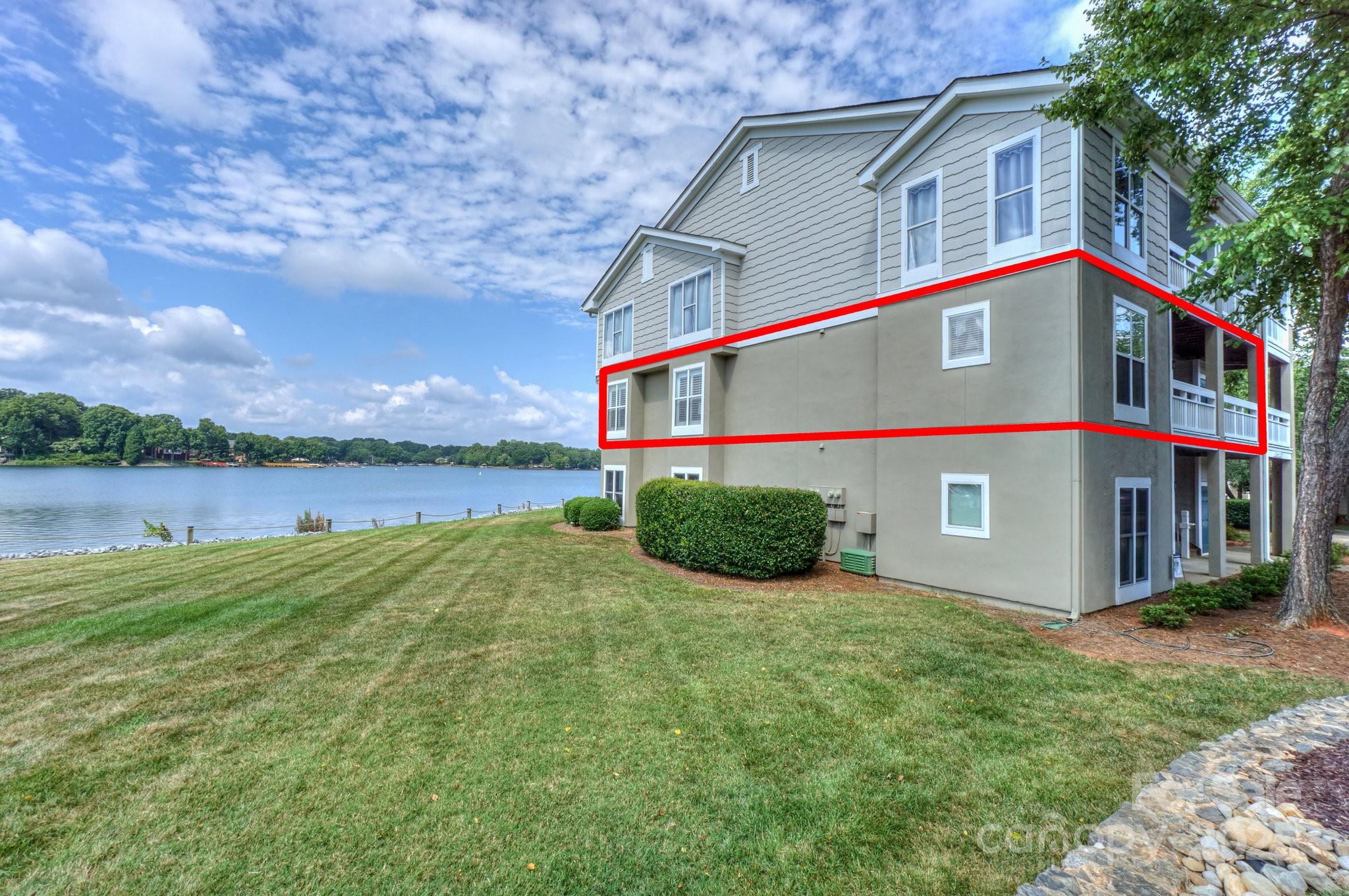 1238 Torrence Circle Davidson, NC 28036 - Photo 38 of 43 a view of a house with yard and lake view