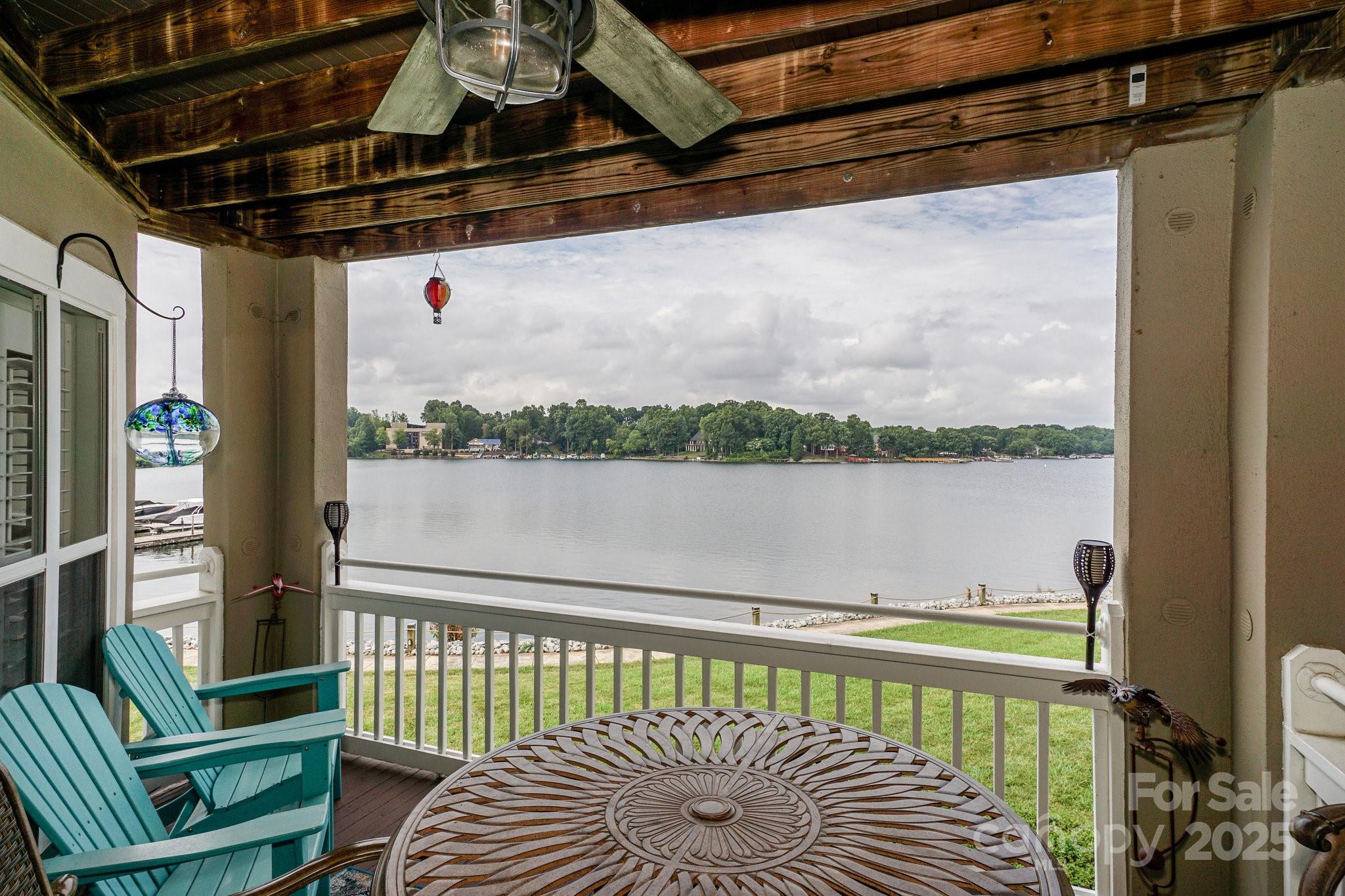 1238 Torrence Circle Davidson, NC 28036 - Photo 41 of 43 a view of a balcony with lake view and wooden floor