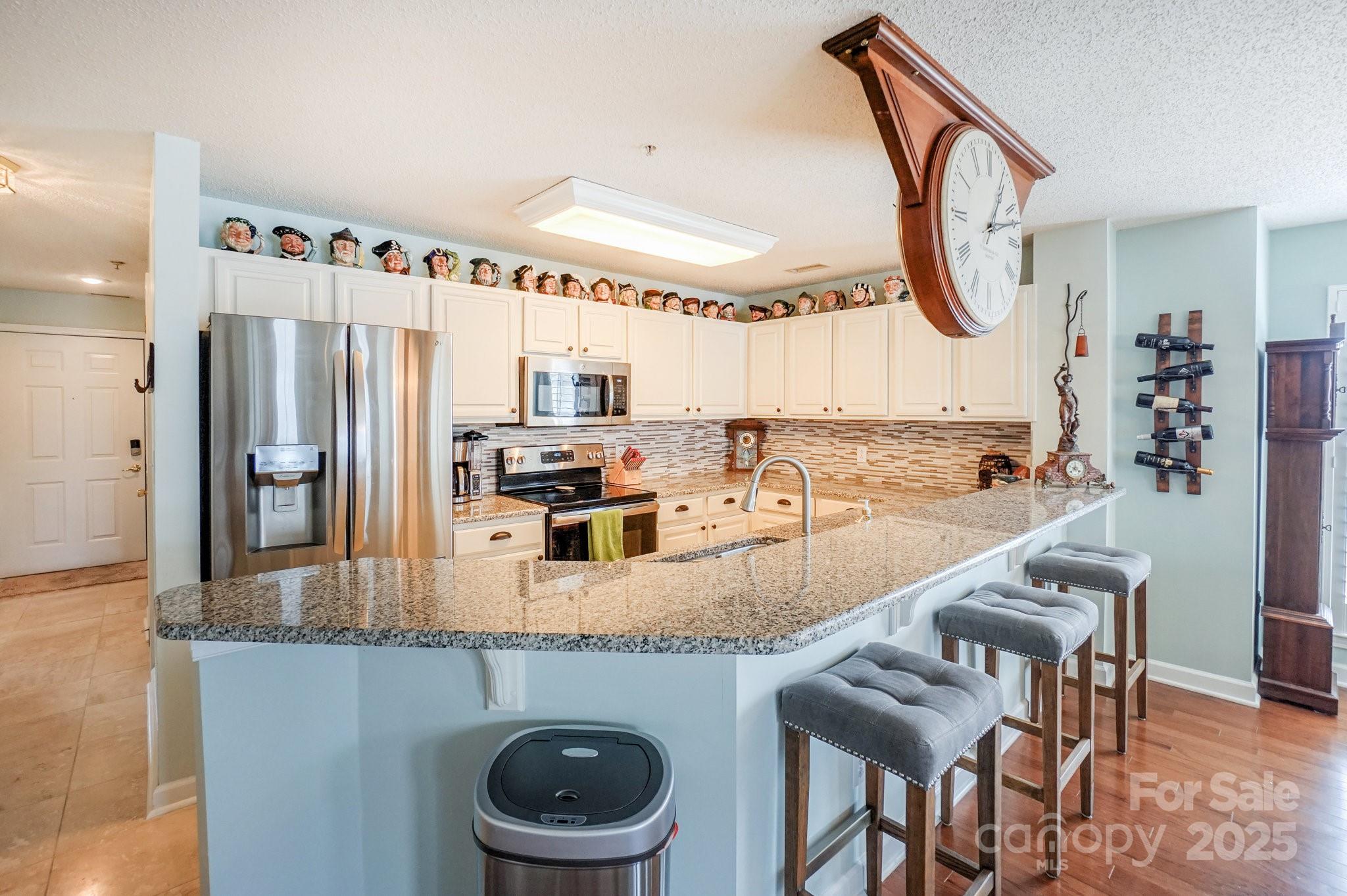 1238 Torrence Circle Davidson, NC 28036 - Photo 8 of 43 a large kitchen with a table and chairs