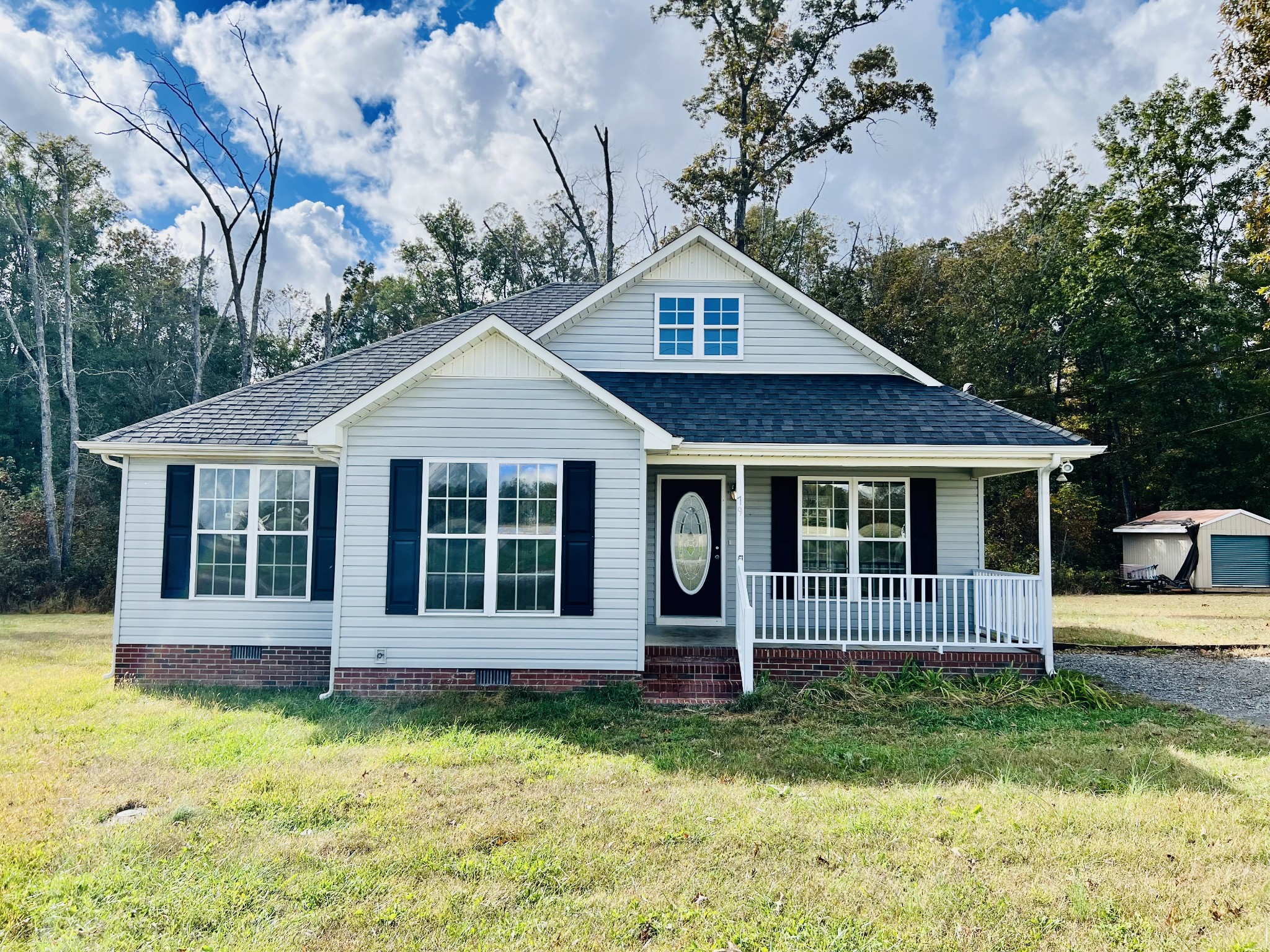 a front view of a house with a yard