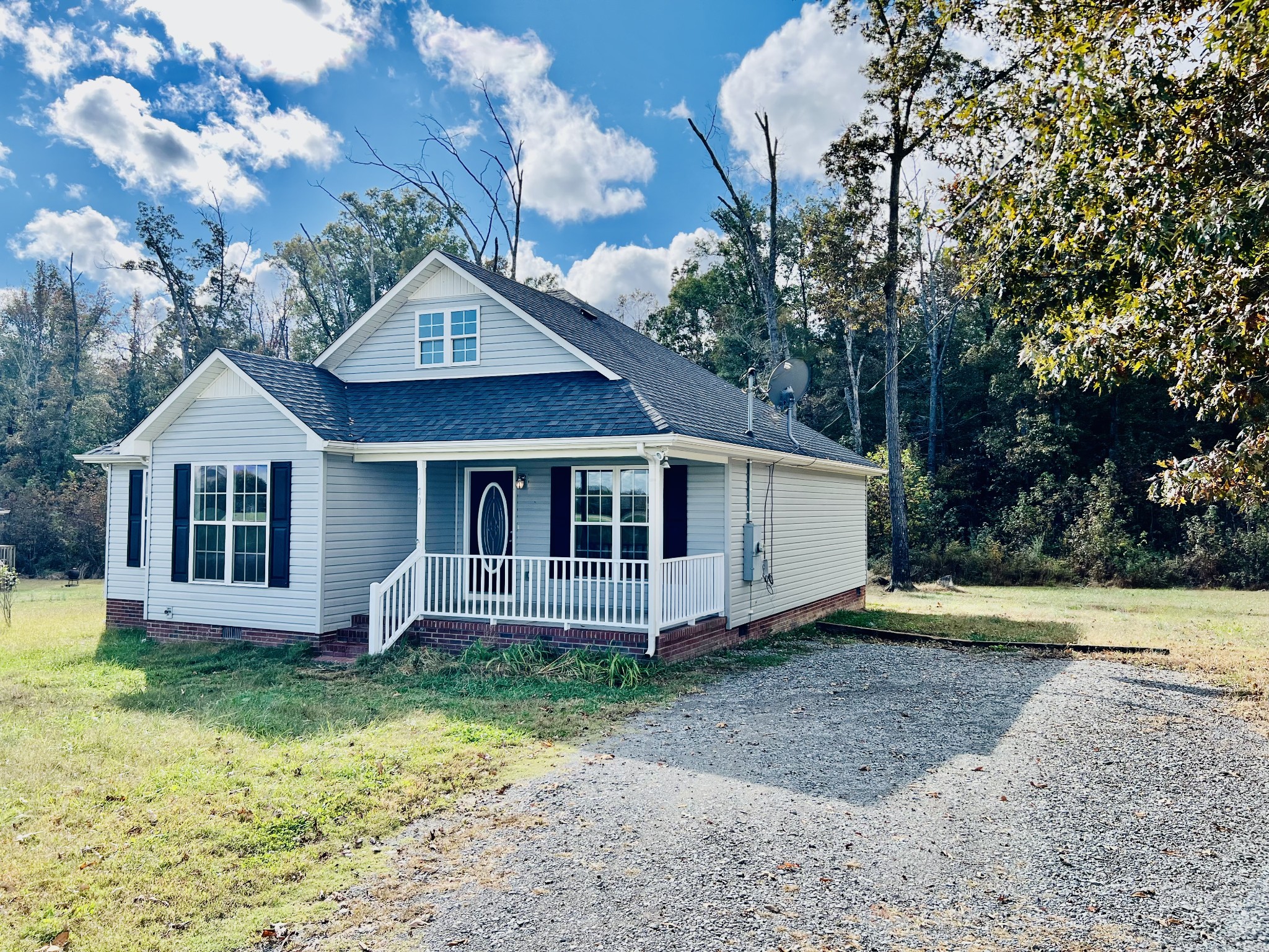 79 Benson School Road Kelso, TN 37348 - Photo 16 of 24 a front view of a house with a yard and trees