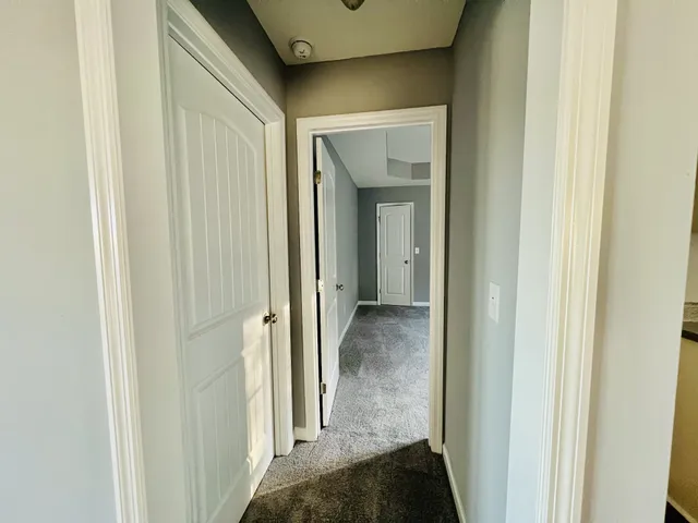 a view of a bathroom from a hallway