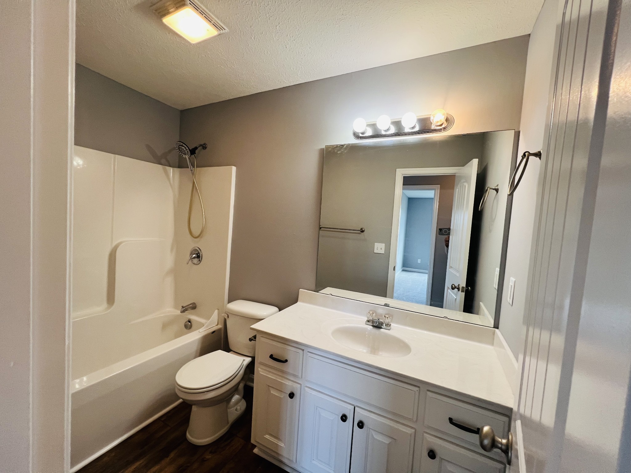79 Benson School Road Kelso, TN 37348 - Photo 7 of 24 a bathroom with a toilet sink shower and mirror
