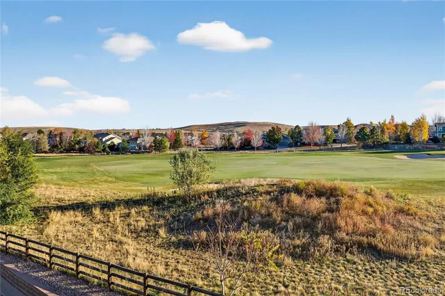 a view of a large body of water with a large building in the background