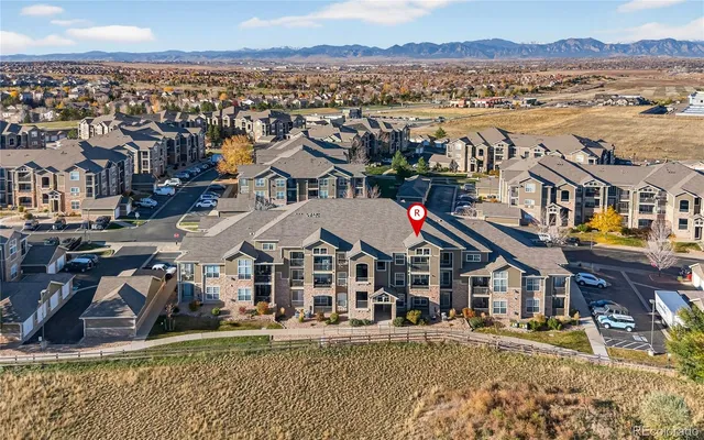 a view of a city with tall buildings and ocean view