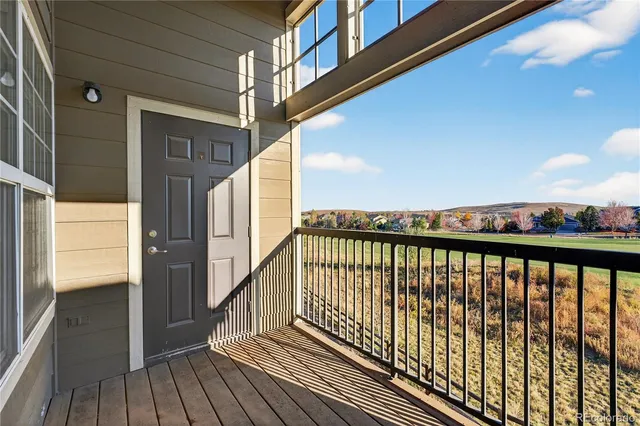 a view of balcony with wooden floor