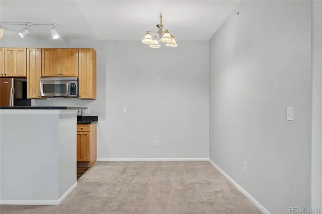 a view of a kitchen with a sink and a microwave