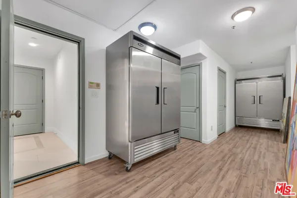 a bedroom with a bed and glass window