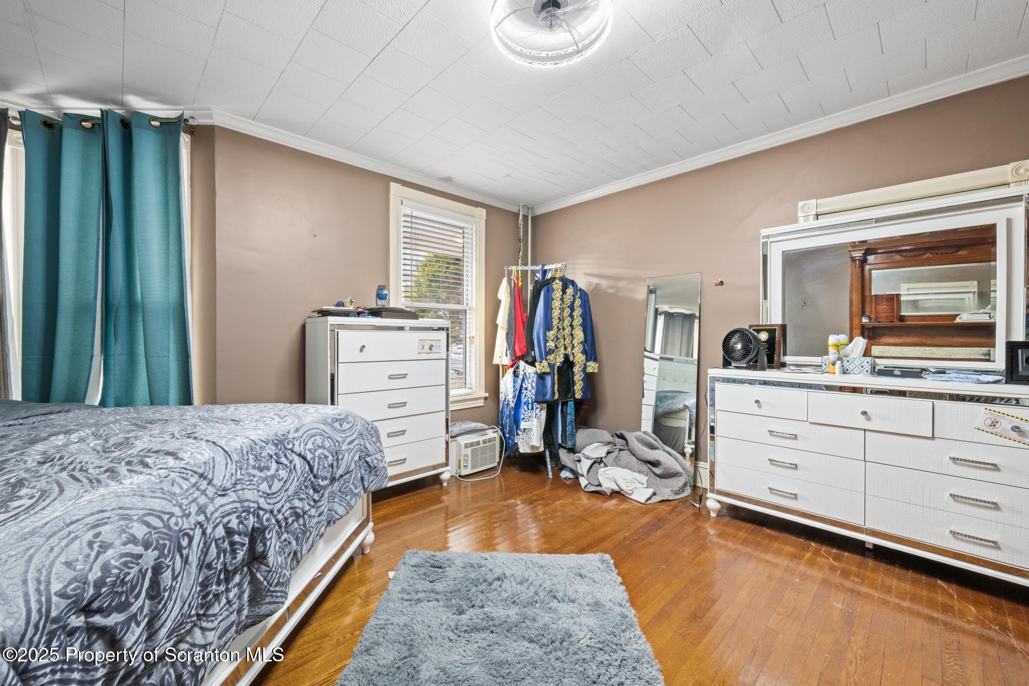 523 North Laurel Street Hazleton, PA 18201 - Photo 15 of 19 a bed room with a bed and a television