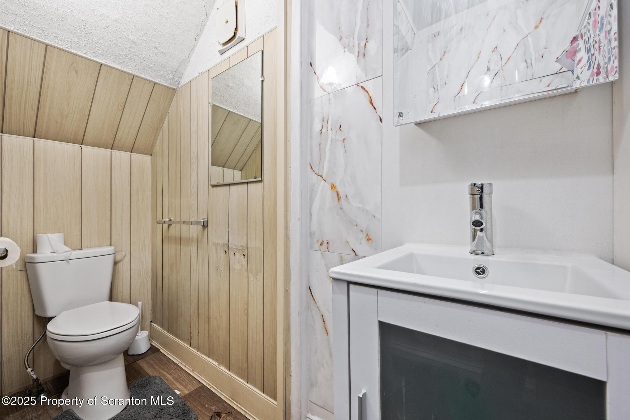523 North Laurel Street Hazleton, PA 18201 - Photo 16 of 19 a bathroom with a sink a toilet and shower