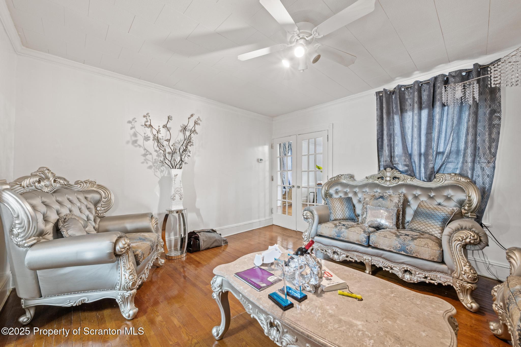 523 North Laurel Street Hazleton, PA 18201 - Photo 18 of 19 a living room with furniture chess table and a chandelier