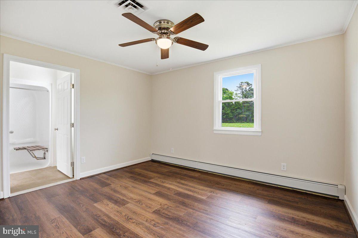 38125 Louis Thomas Road Avenue, MD 20609 - Photo 30 of 73 PRIMARY BEDROOM NEW LVP, NEW CEILING FAN 2026 YR
