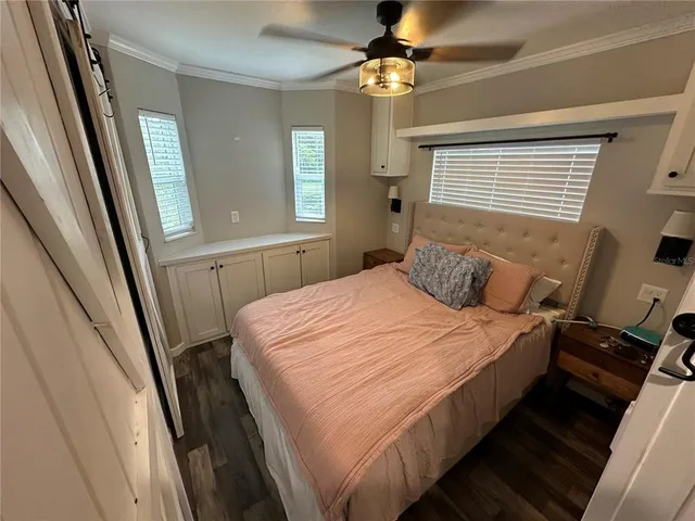 a bedroom with double bed and a mirror