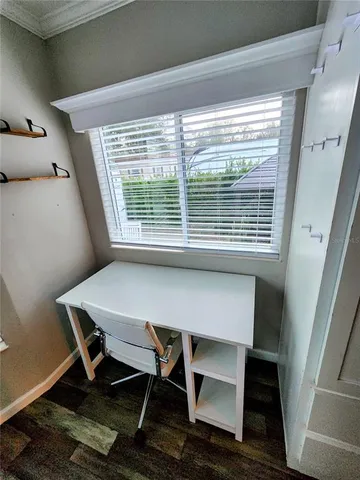 a workspace with furniture and a window