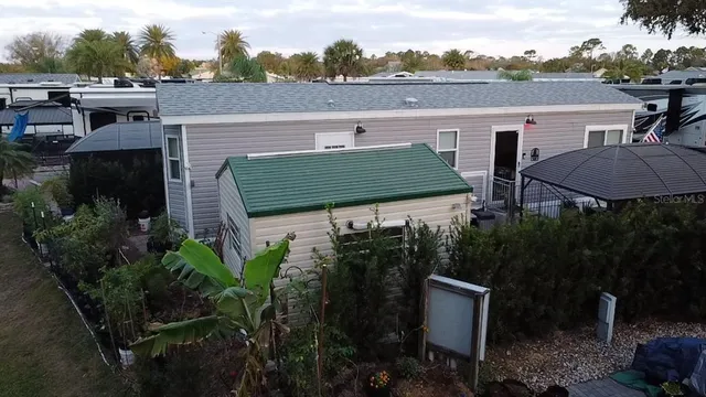 a view of a terrace with a garden and chairs