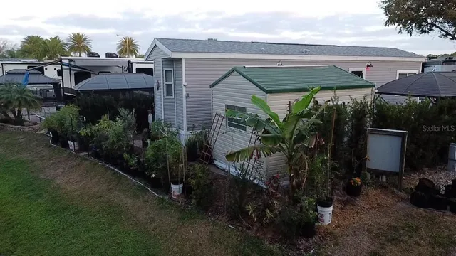 a view of a house with a yard and plants