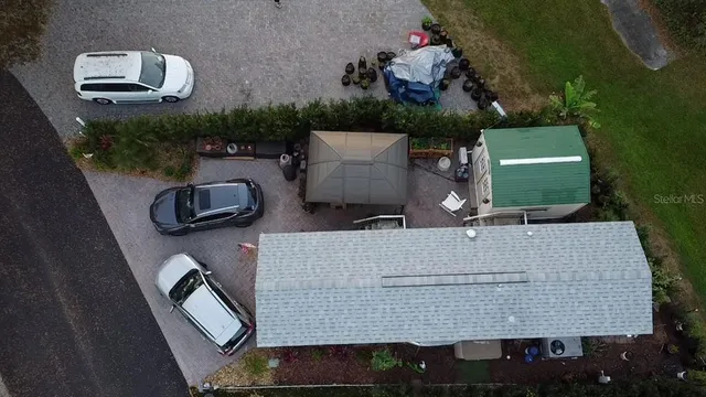 an aerial view of a house with outdoor space sitting space