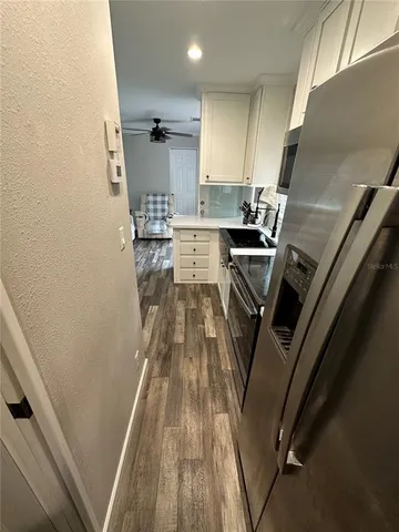 a view of a kitchen with a sink