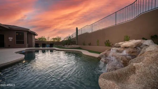 a view of a swimming pool with a lounge chair