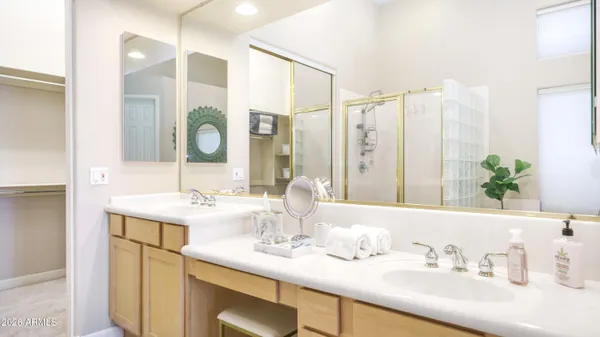 a bathroom with a double vanity sink and a mirror