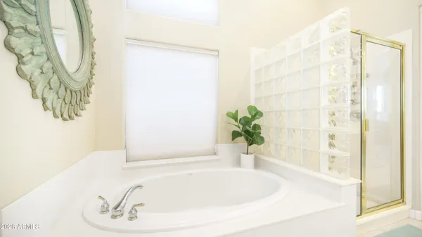 a white bath tub with a shower