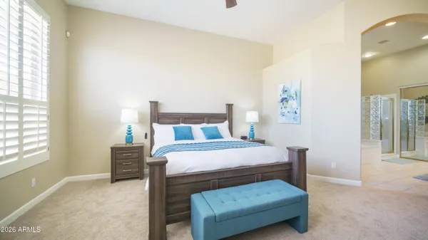 a bedroom with a bed and a couch