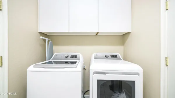 a utility room with dryer and washer