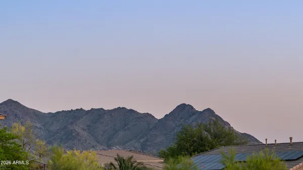 a view of a house with a mountain and a mountain view