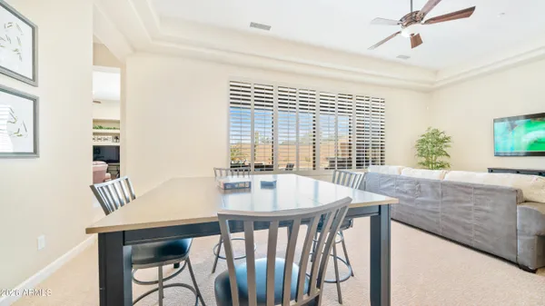 a dining room with furniture and window