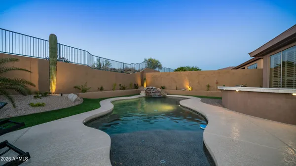a view of a swimming pool with a patio